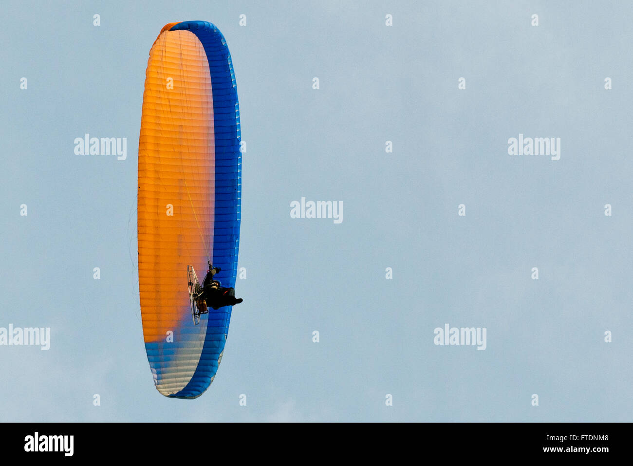 A Paraglider flying above Skegness Beach, Lincolnshire, UK Stock Photo