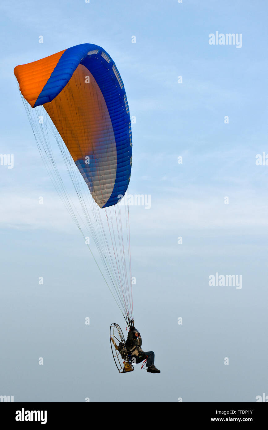 A Paraglider flying above Skegness Beach, Lincolnshire, UK Stock Photo