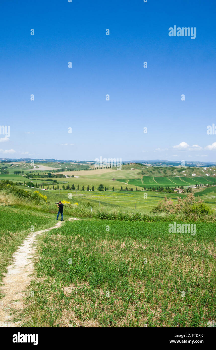 Rolling hills in Tuscany on a sunny day with dramatic clouds Stock Photo -  Alamy