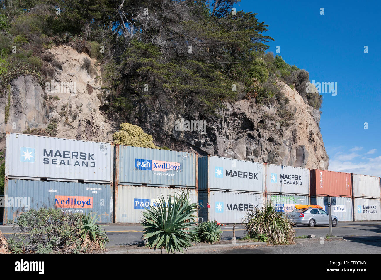 Shipping containers stacked to prevent earthquake rock fall, Esplanade, Sumner, Christchurch, Canterbury Region, New Zealand Stock Photo