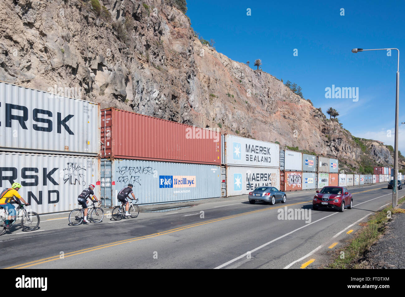 Shipping containers stacked to prevent earthquake rock fall, Esplanade, Sumner, Christchurch, Canterbury Region, New Zealand Stock Photo