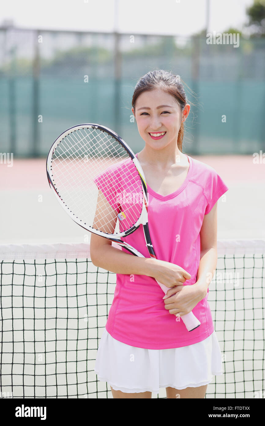 Young Japanese tennis player on the court Stock Photo Alamy