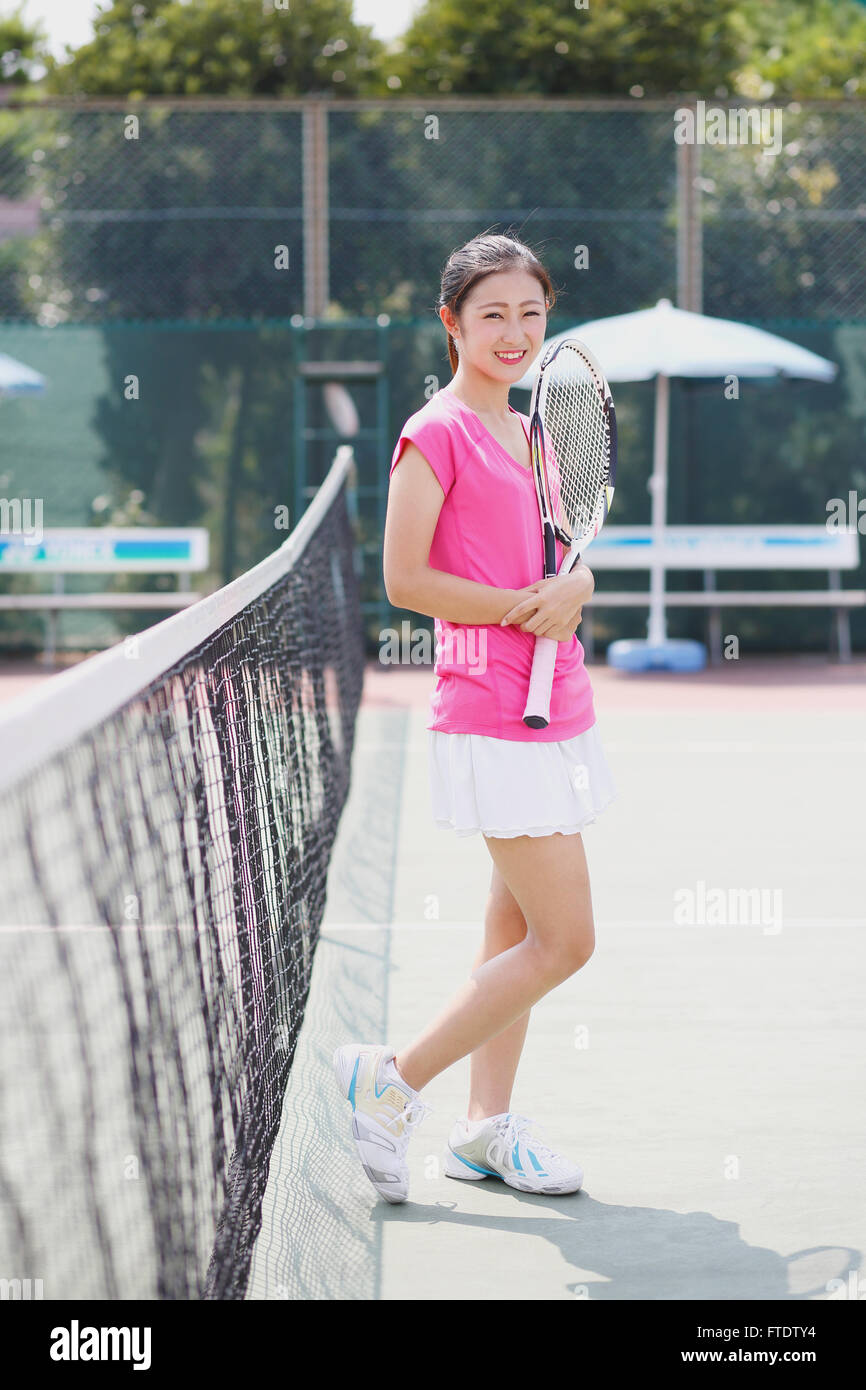 Young Japanese tennis player on the court Stock Photo Alamy