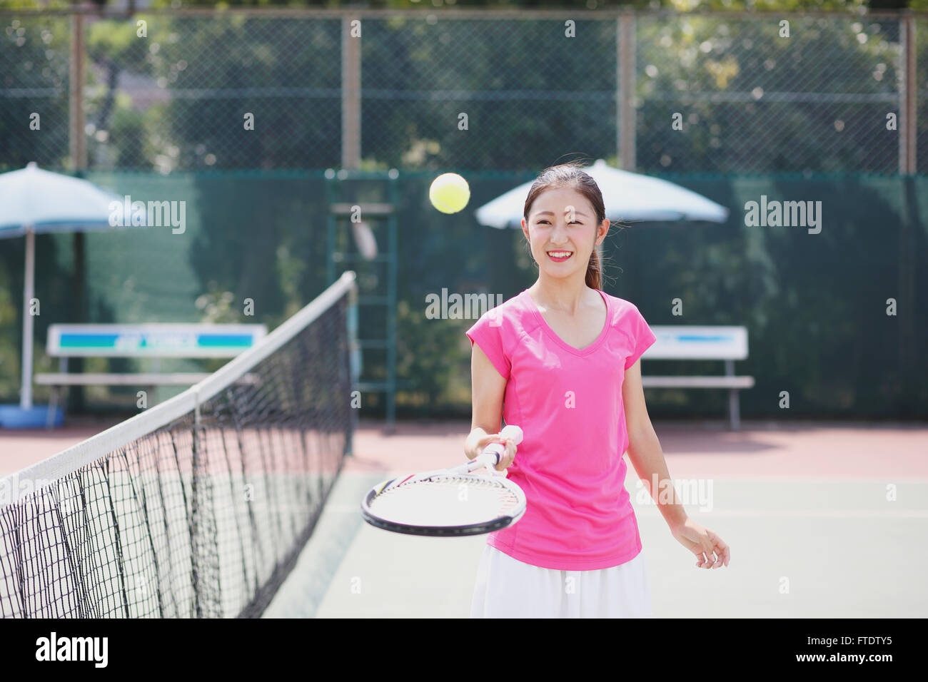Young Japanese tennis player on the court Stock Photo Alamy