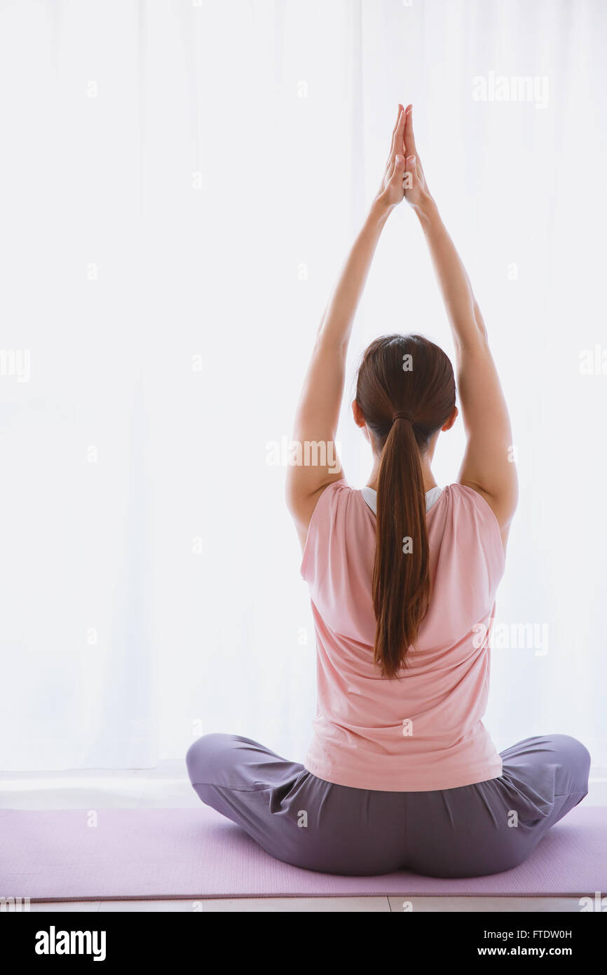 Young Japanese woman practicing yoga Stock Photo - Alamy