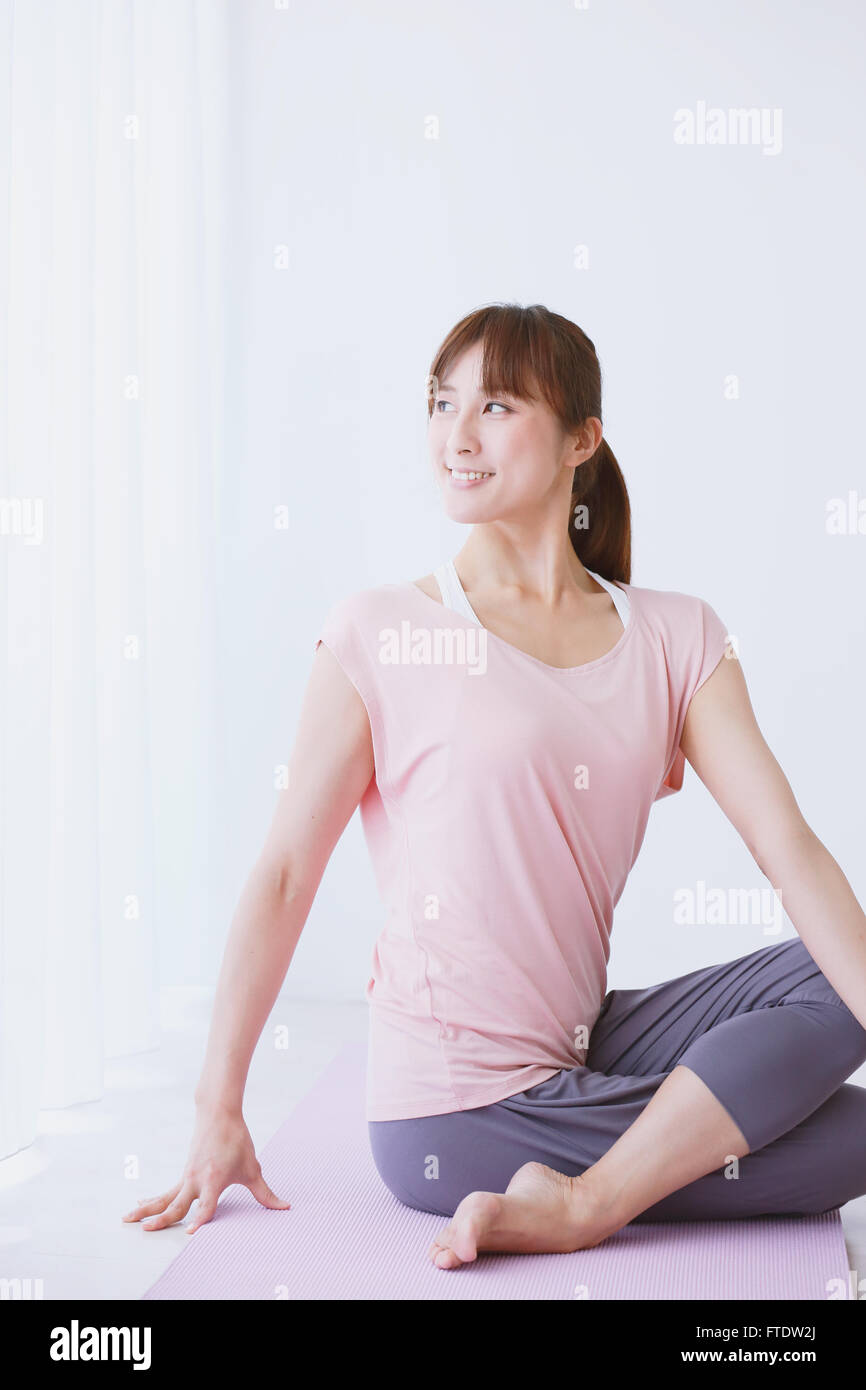 Young Japanese woman practicing yoga Stock Photo - Alamy
