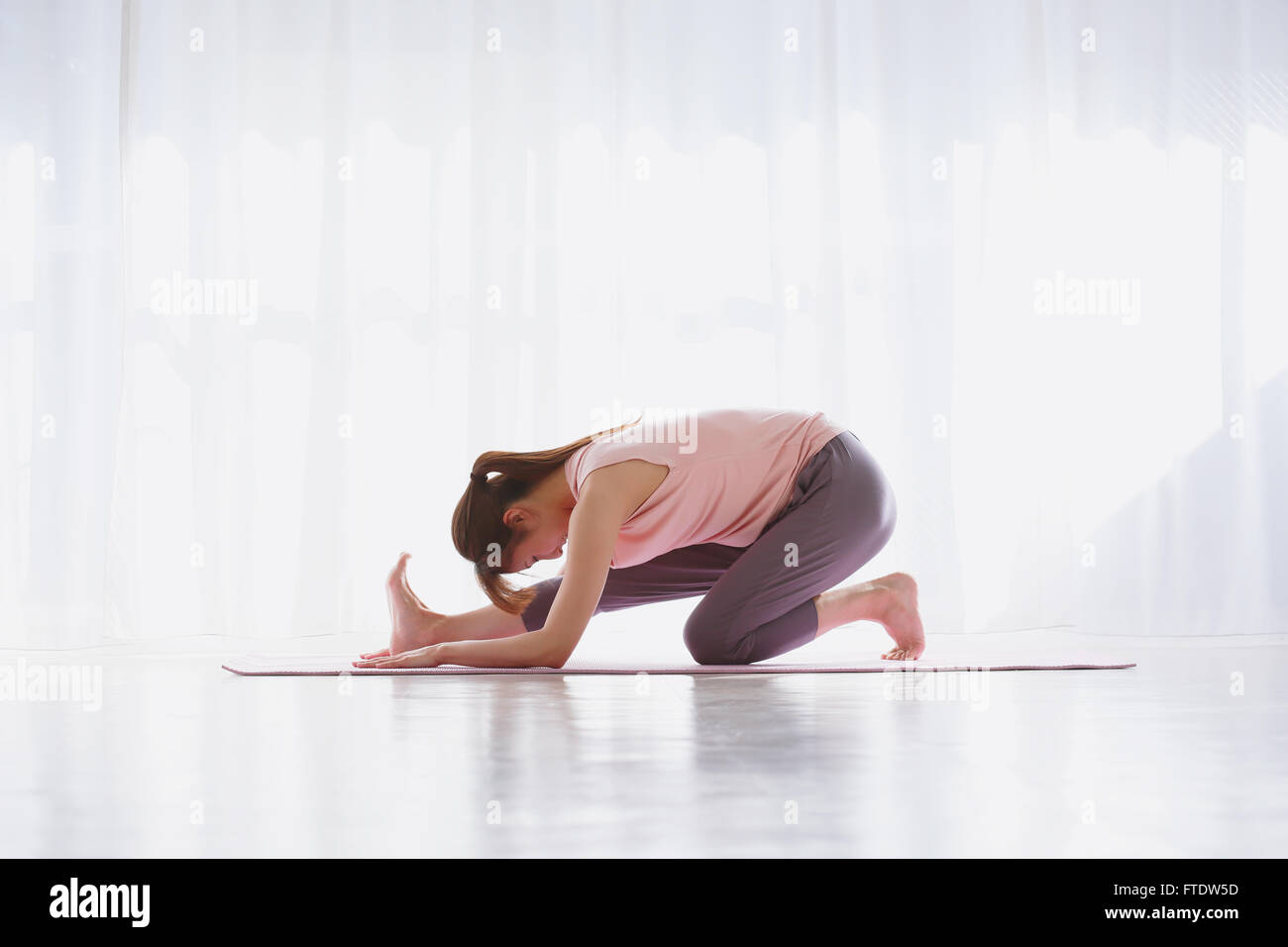 Young Japanese woman practicing yoga Stock Photo - Alamy
