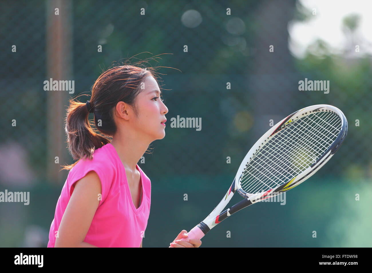 Young Japanese tennis player in action Stock Photo - Alamy