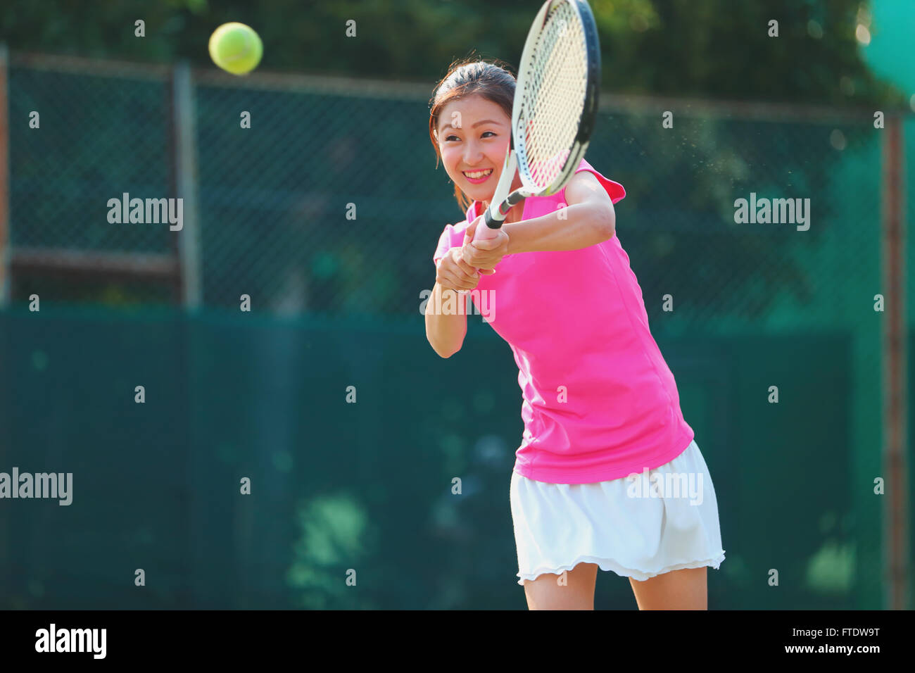 Young Japanese tennis player in action Stock Photo - Alamy