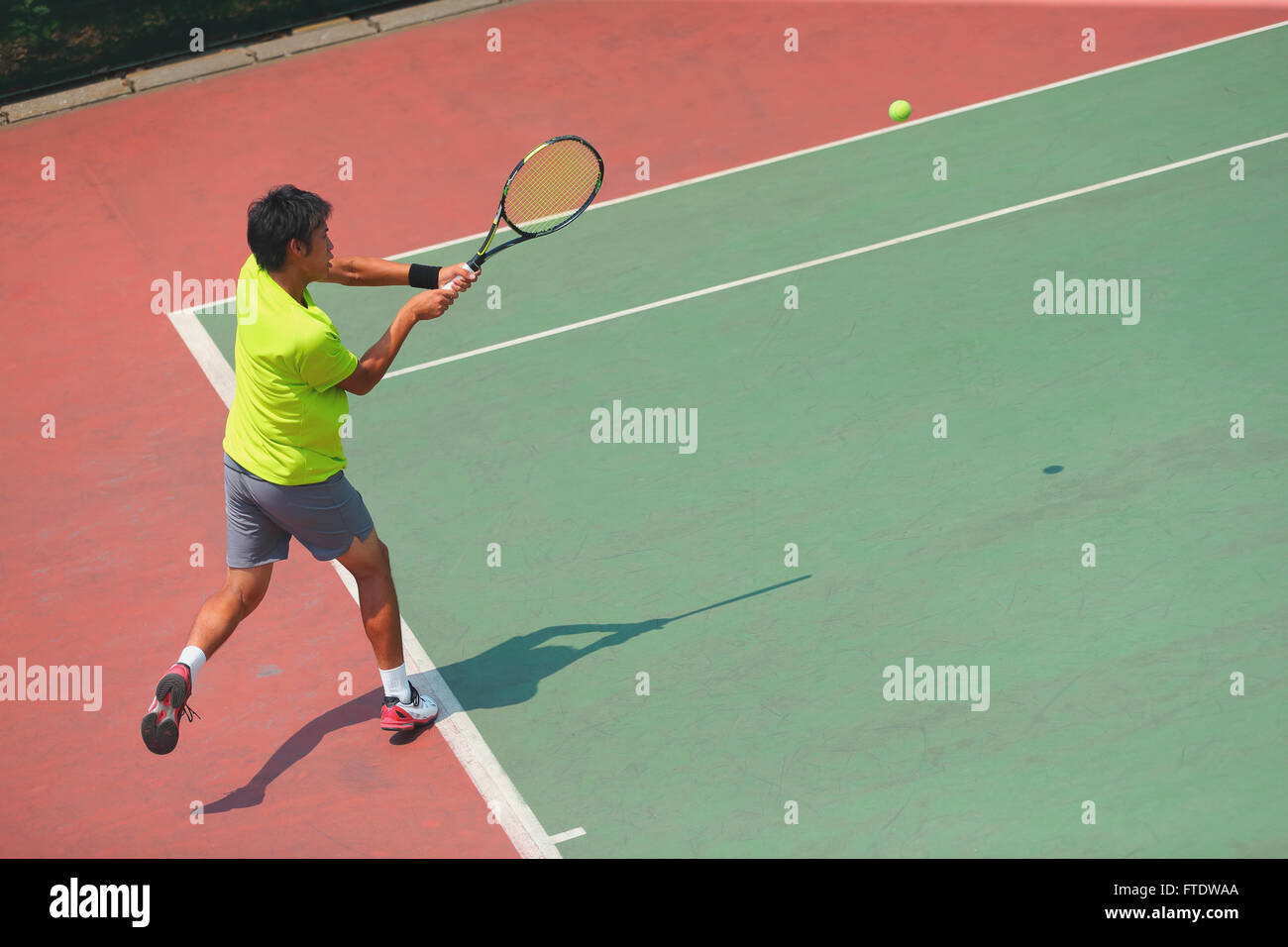 Young Japanese tennis player in action Stock Photo - Alamy