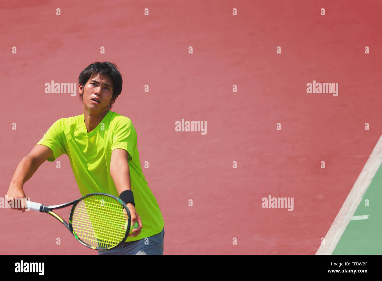 Young Japanese tennis player in action Stock Photo - Alamy