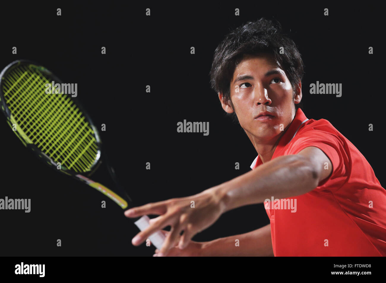 Young Japanese tennis player in action Stock Photo