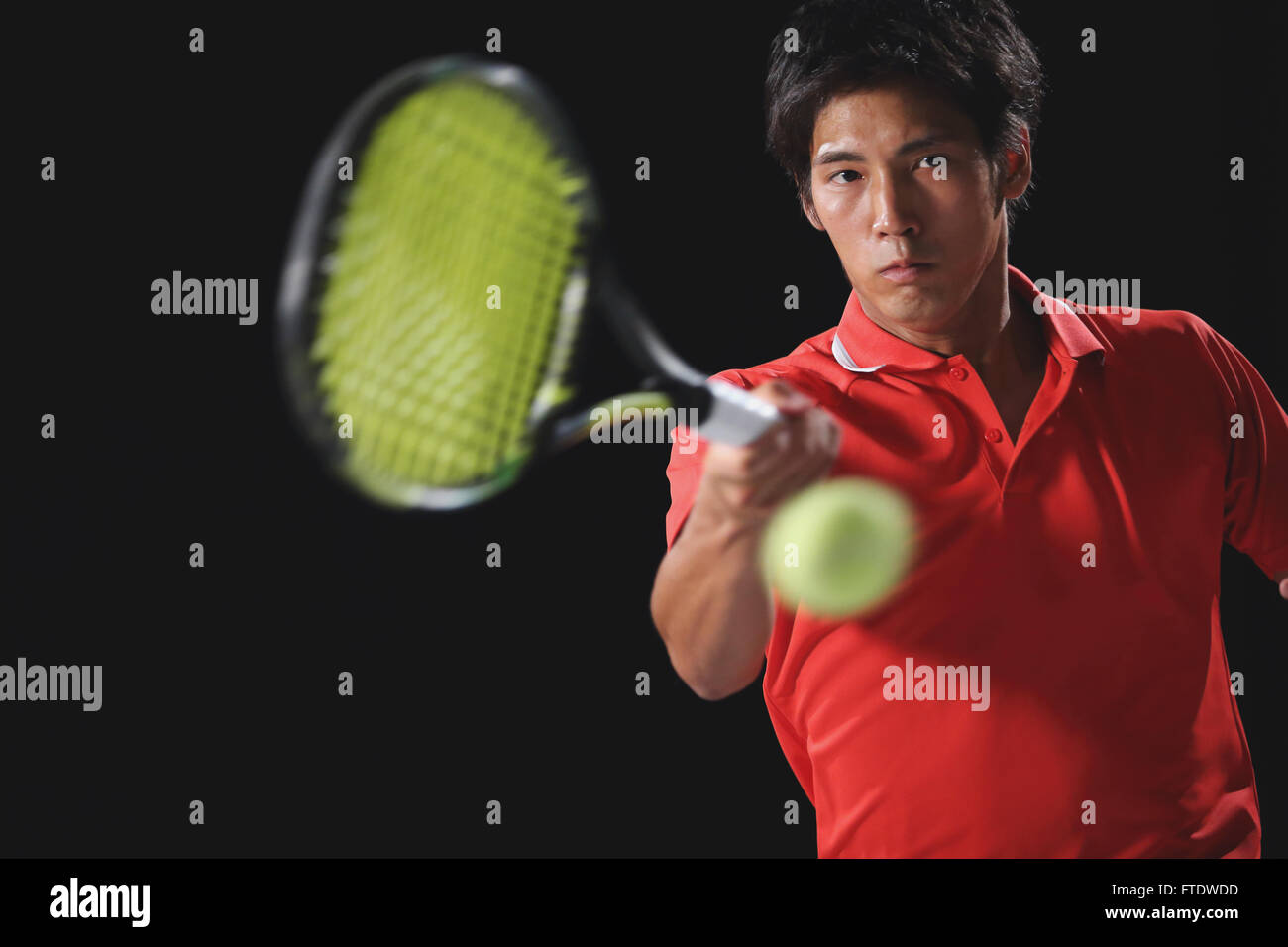 Young Japanese tennis player in action Stock Photo