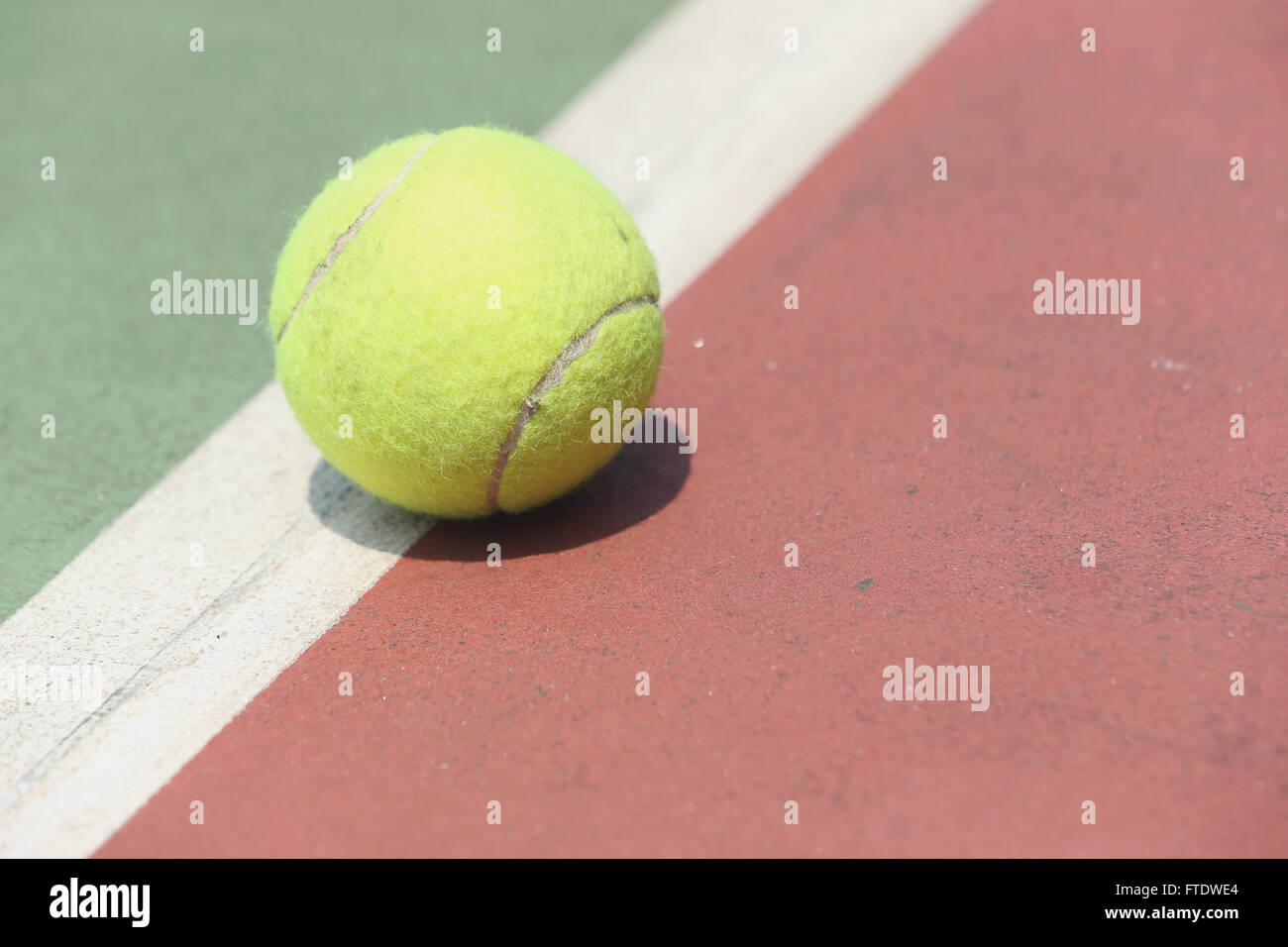 Tennis ball on court Stock Photo Alamy