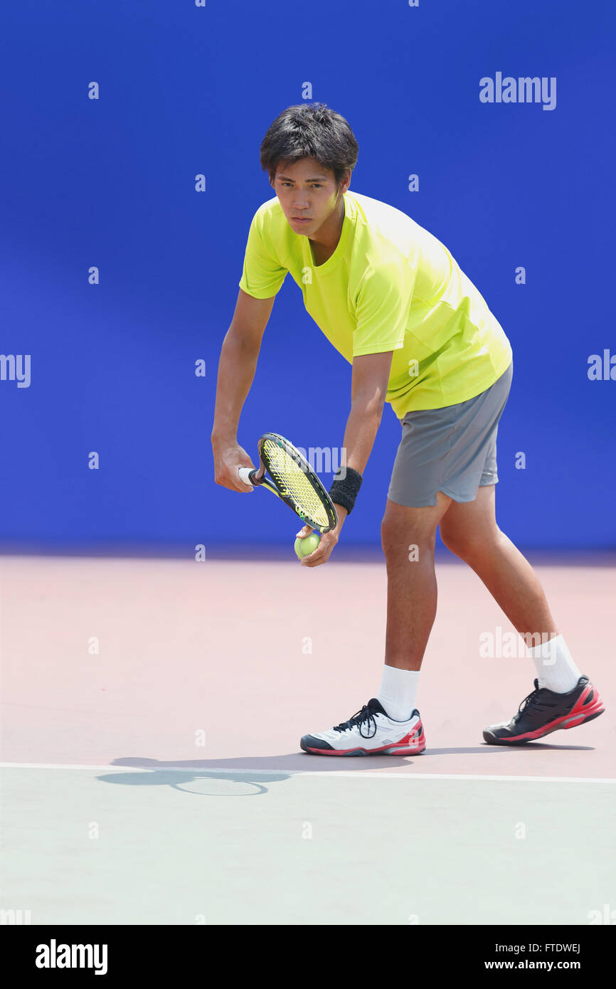 Young Japanese tennis player in action Stock Photo