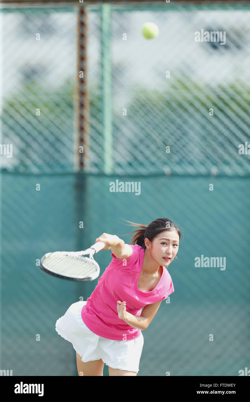 Young Japanese tennis player in action Stock Photo