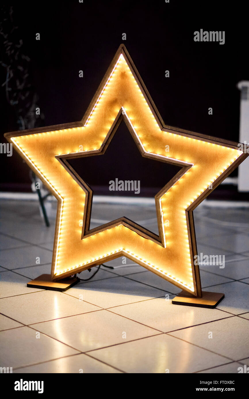 Homemade wooden star with led lighting and decoration events. Stock Photo