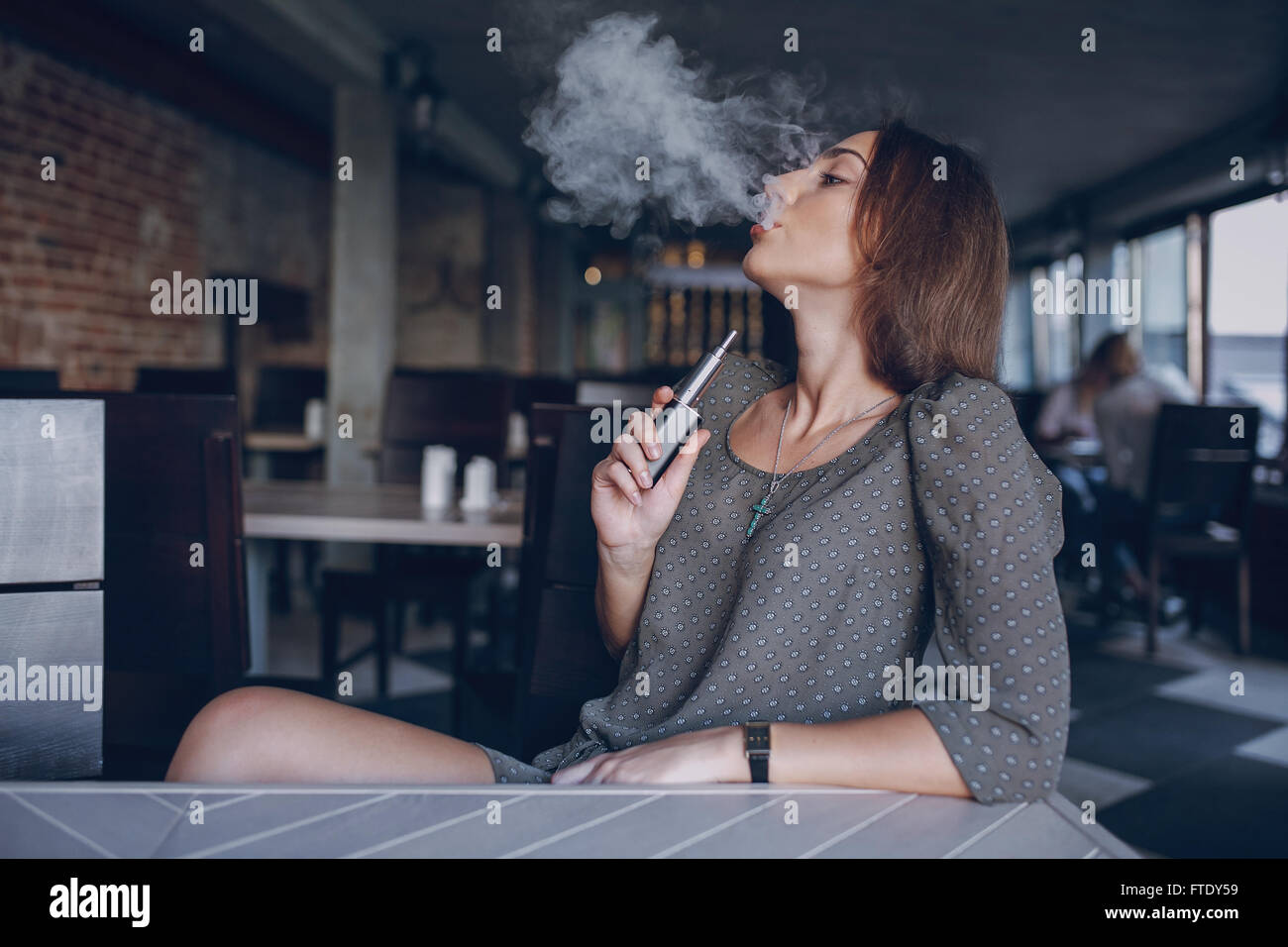 Girl with E-cigarette Stock Photo