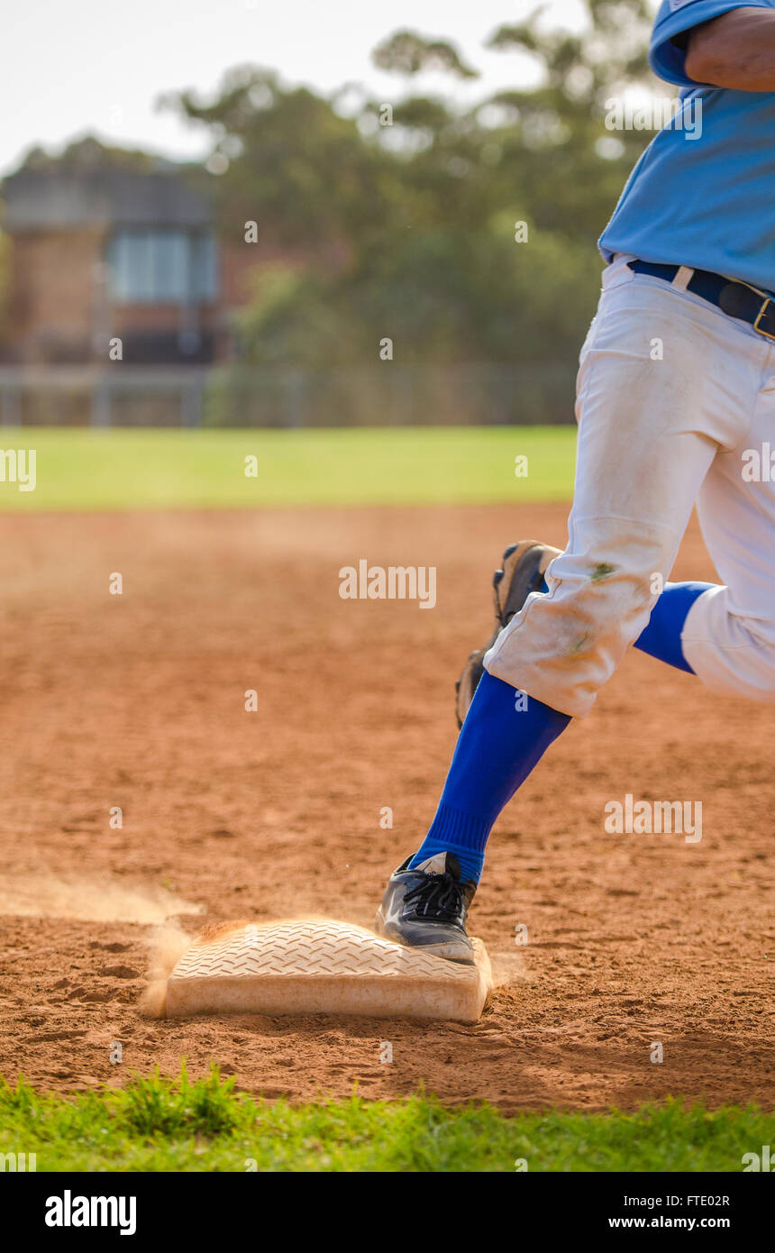 Baseball player runs into third base Stock Photo Alamy