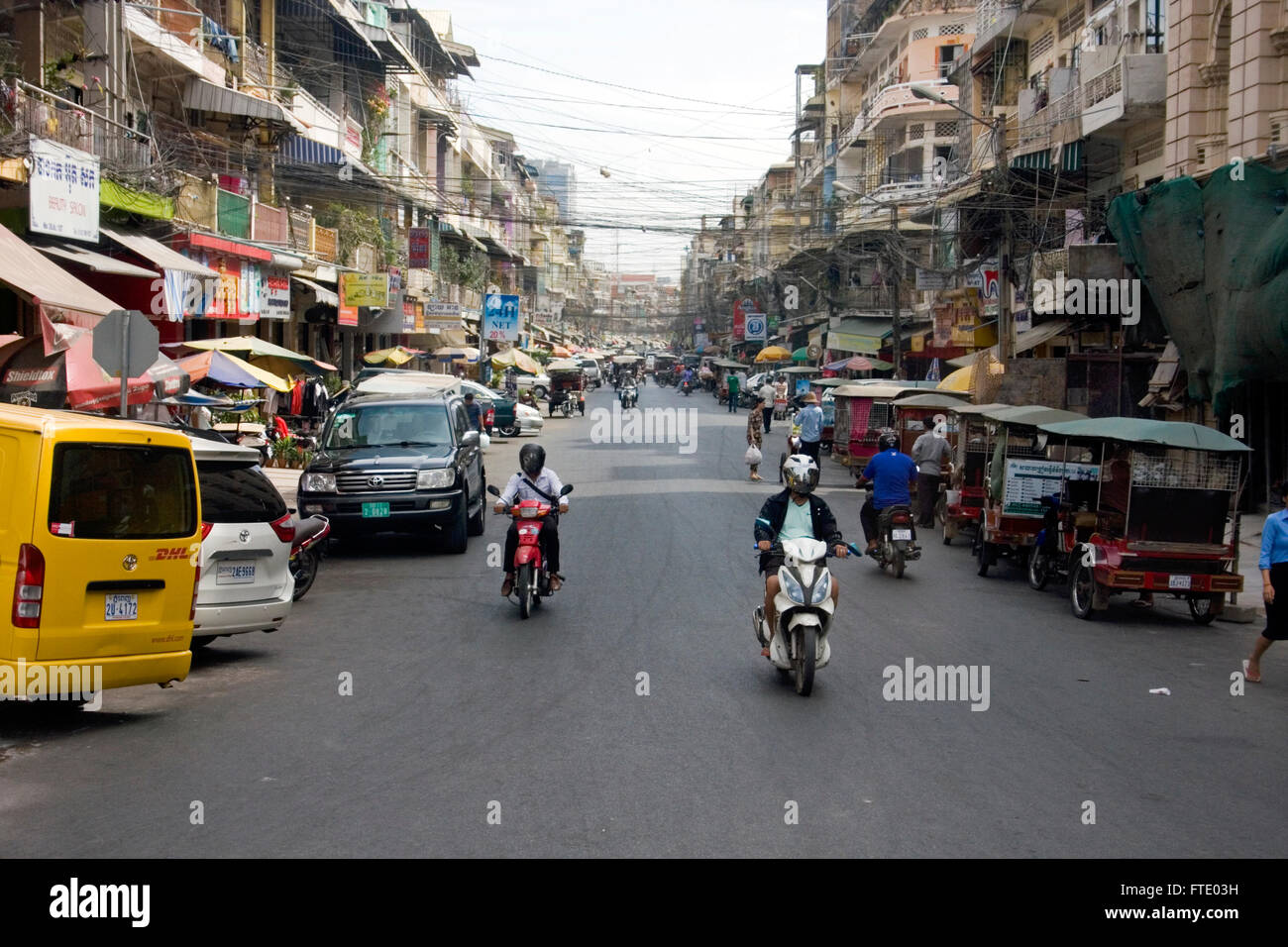 Street 107 is bustling with activity and traffic in Phnom Penh, Cambodia. Stock Photo