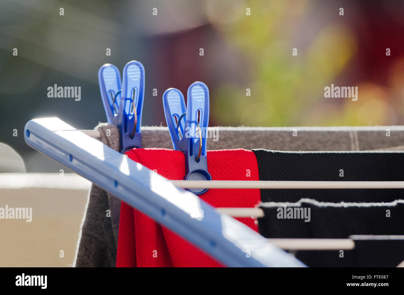 Laundry clips and clothing on a clothes line Stock Photo Alamy