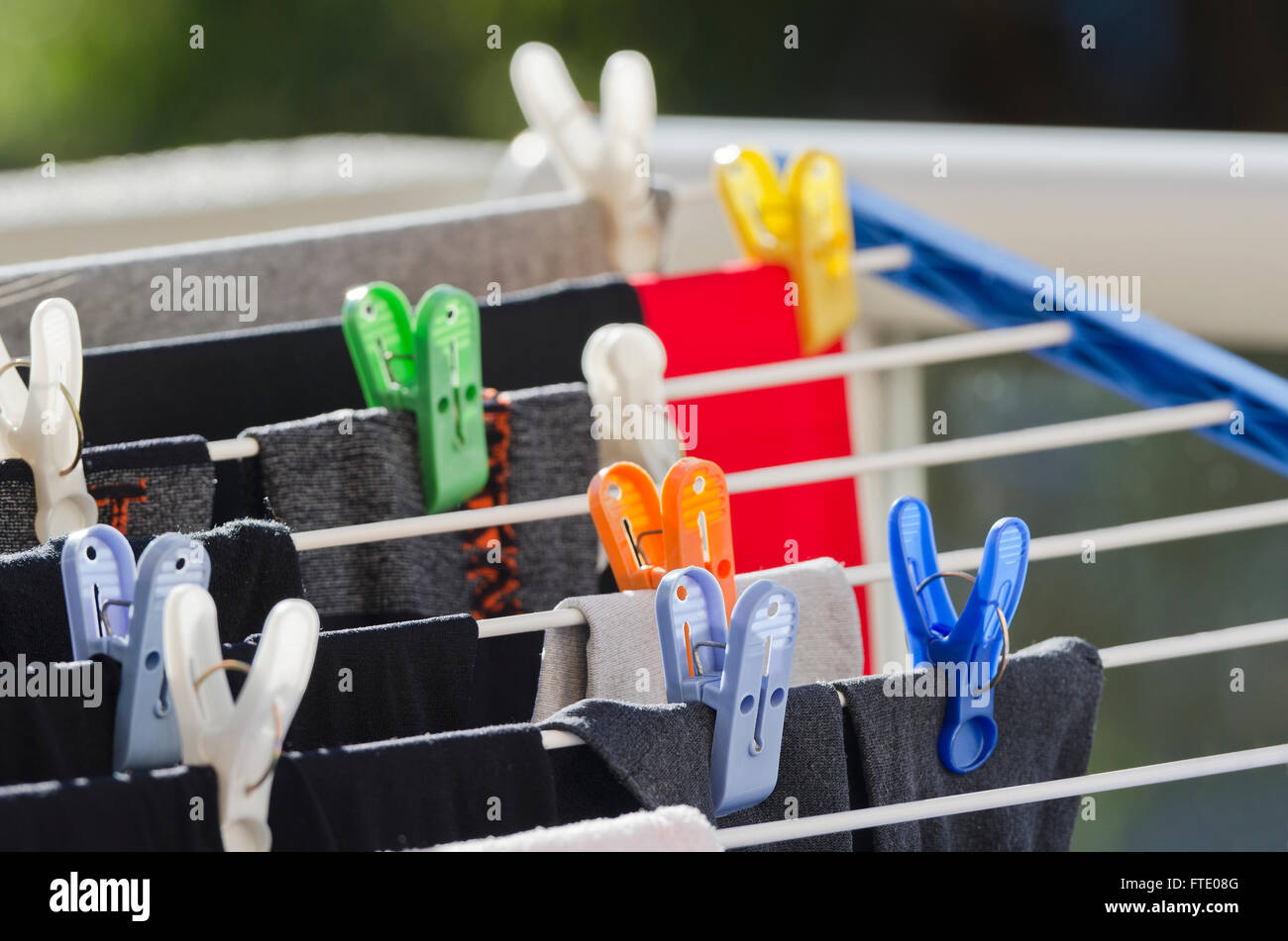 Laundry clips and clothing on a clothes line Stock Photo Alamy