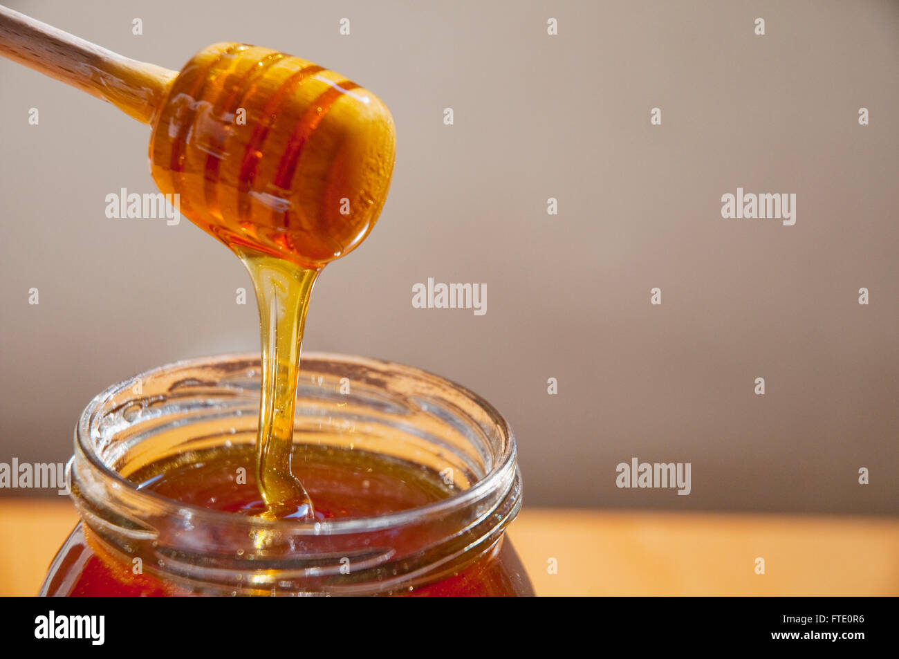 Honey pouring. Close view. Stock Photo