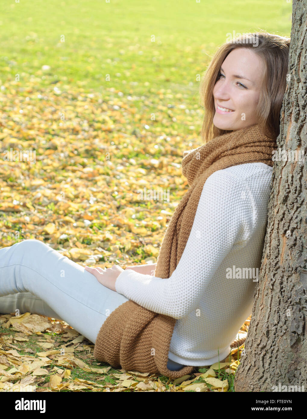 Young woman portrait in autumn fall park Stock Photo - Alamy