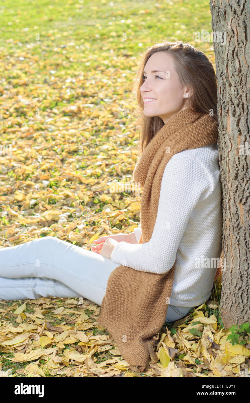 Young woman portrait in autumn fall park Stock Photo - Alamy