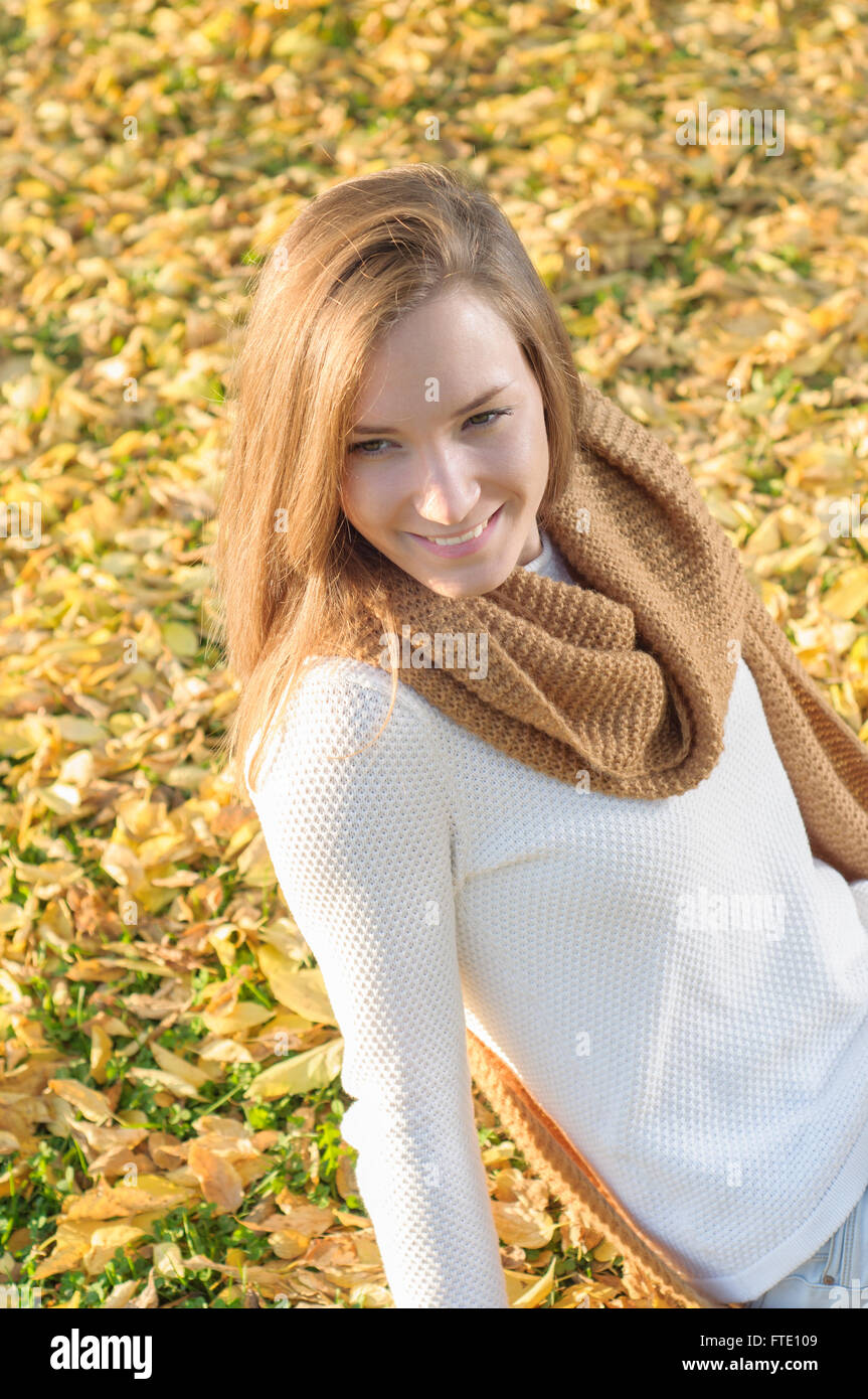 Young woman portrait in autumn fall park Stock Photo - Alamy