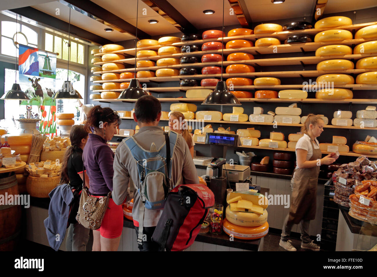 Wheels of gouda cheese for sale in the ''Kaaswinkeltje' cheese shop in Gouda, South Holland, Netherlands. Stock Photo