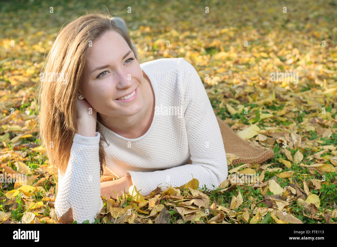 Young woman portrait in autumn fall park Stock Photo - Alamy