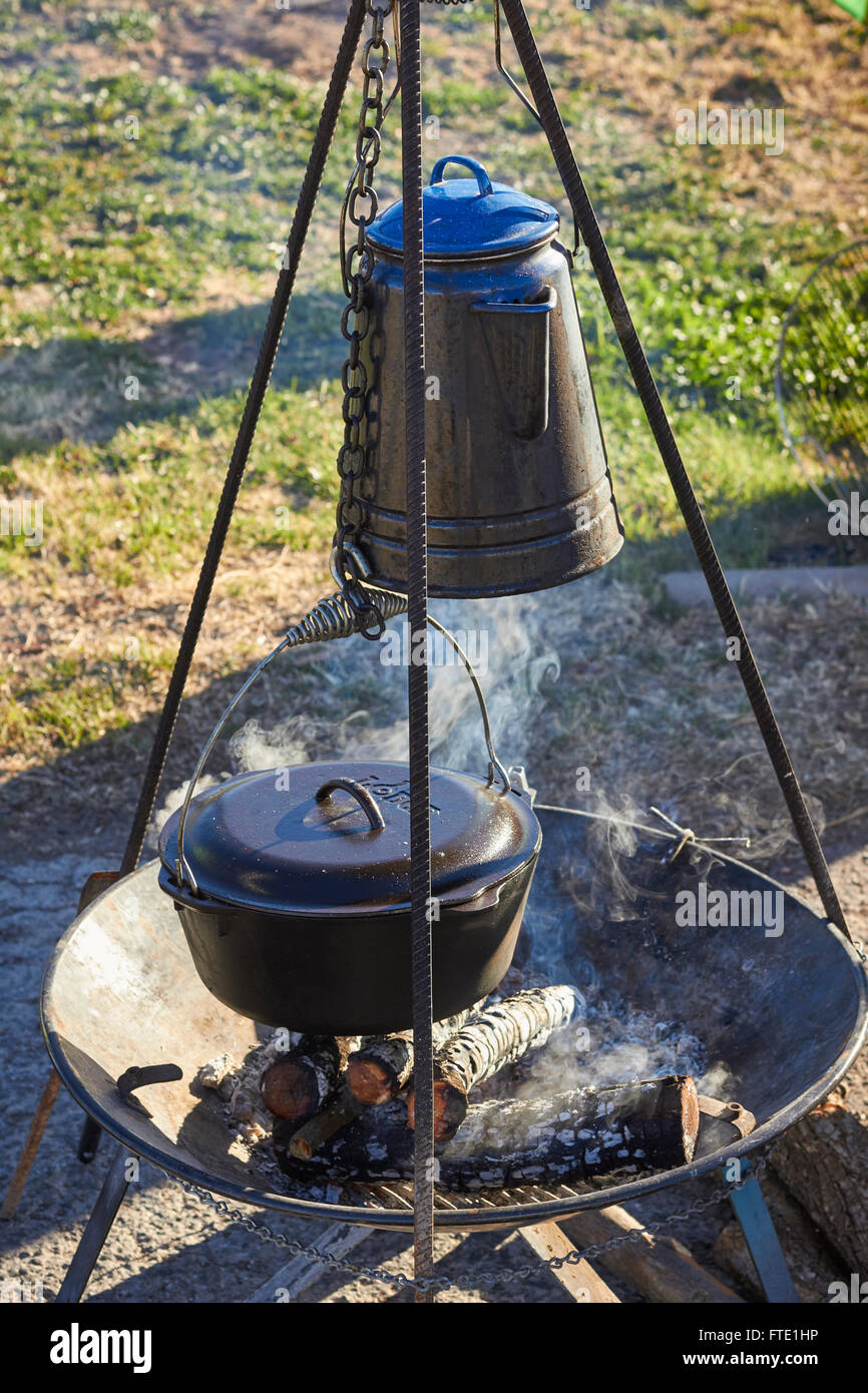 blue enamel coffee pot over an open fire, cowboy style, Alpine, Texas, USA Stock Photo