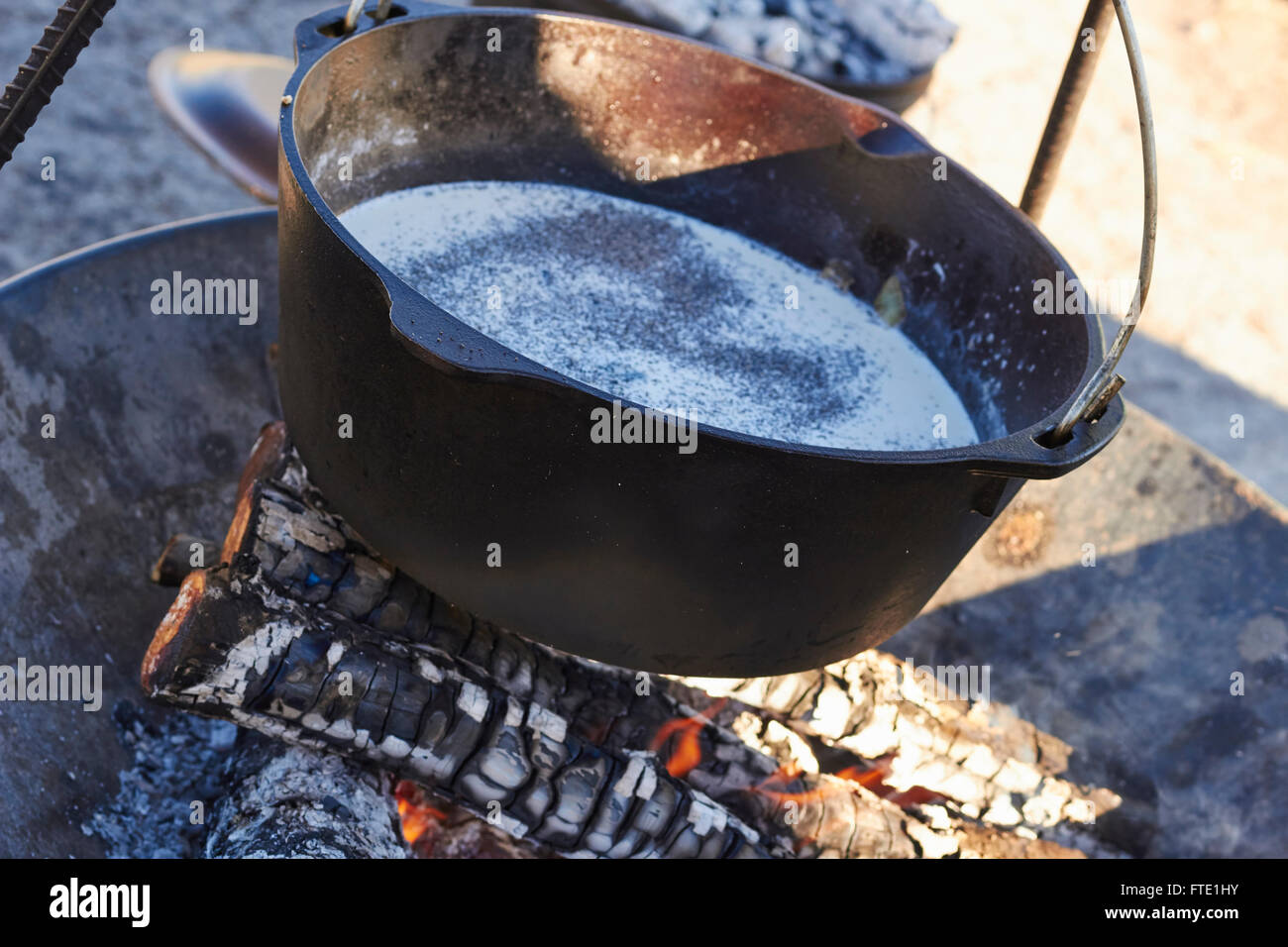 cooking in a cast iron pot over an open fire, cowboy style, Alpine, Texas, USA Stock Photo