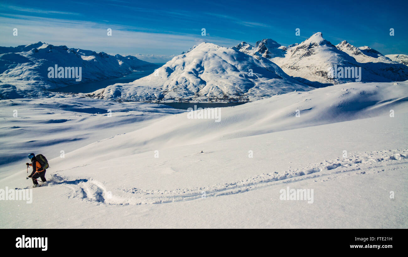 Skiing on Rodtinden with views towards Store Blamann, Kvaloya Troms, Northern Norway Stock Photo