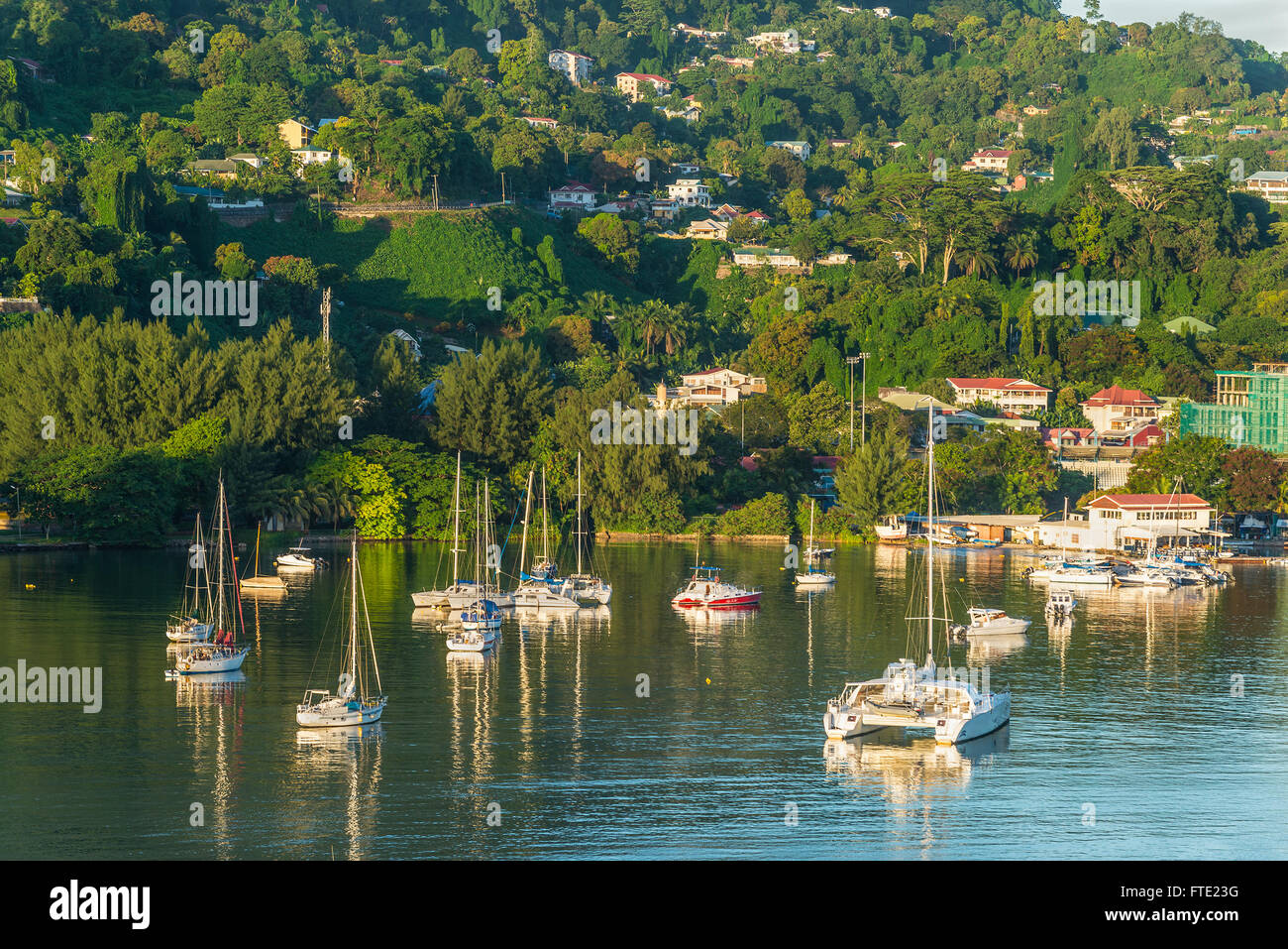 Beautiful yachts and boats in the morning sun in the harbor of Port Victoria Stock Photo