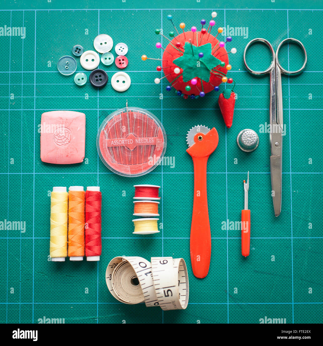 Sewing equipment arranged on a cutting mat Stock Photo