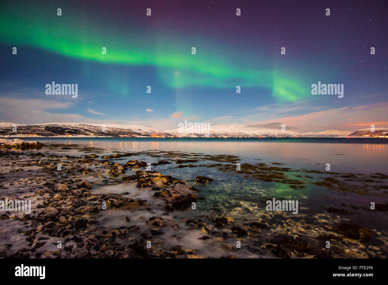 Aurora Borealis dancing over fjord, Tromso Northern Norway Stock Photo ...