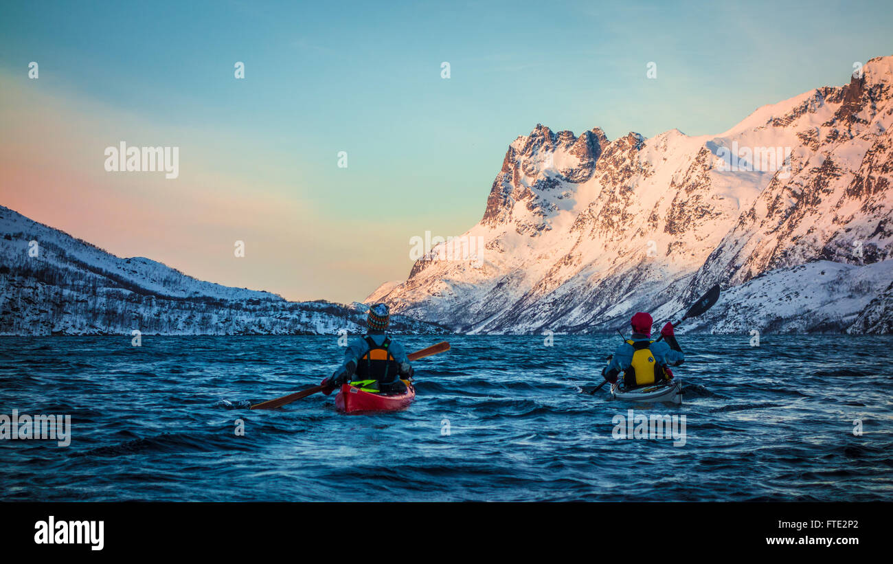 Winter kayaking in Ersfjord, Kvaloya near Tromso Northern Norway Stock Photo