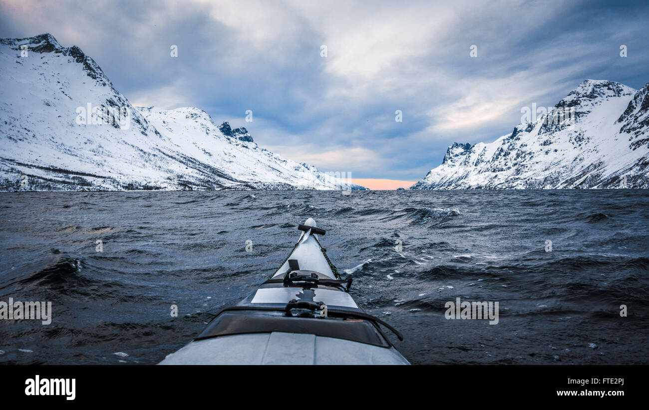 Winter kayaking in Ersfjord, Kvaloya near Tromso Northern Norway Stock Photo