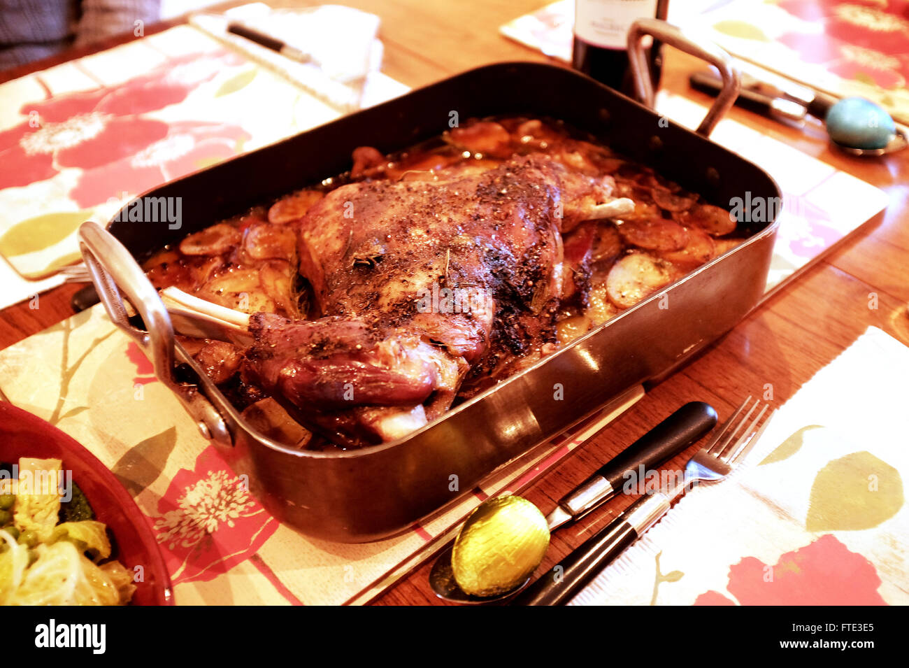 Sunday lunch of slow roasted lamb shoulder with potatoes Stock Photo