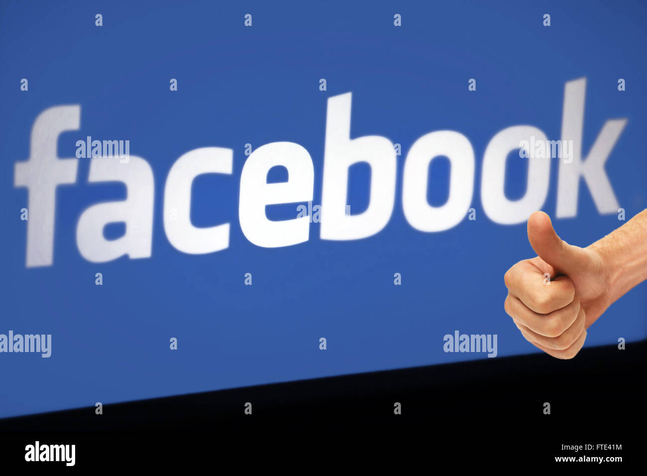 Like facebook with real thumb up. Social Media is so great, thumps up! Stock Photo