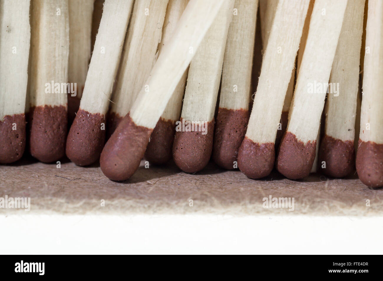 Macro close up image of common brown headed matches used for lighting gas, cigarettes, or candles. Stock Photo