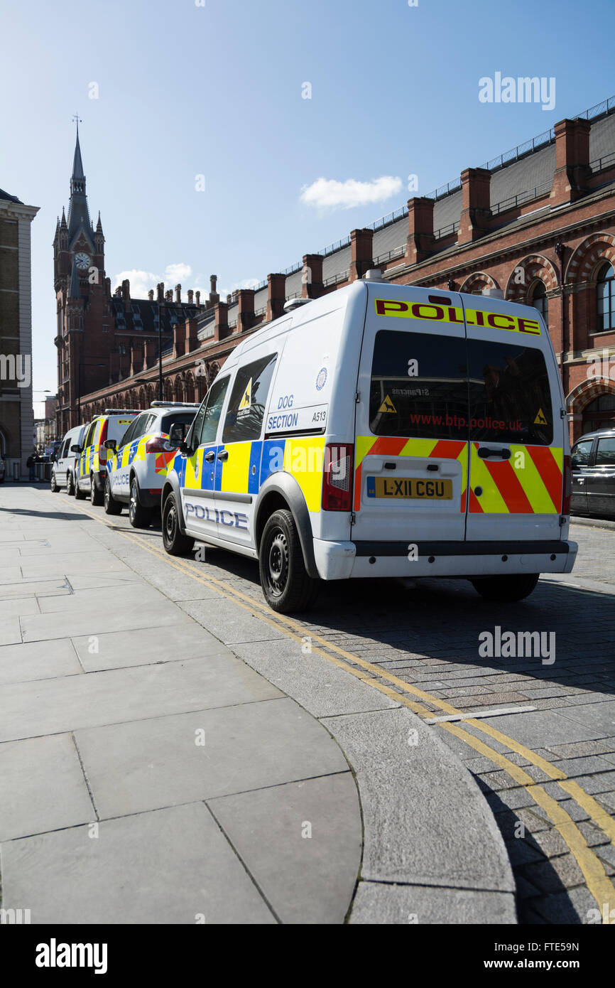 Police cars and vans wait outside St Pancras Station in Central London, UK Stock Photo