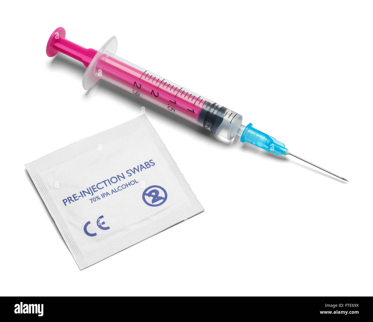 Small Syringe and Needle with Alcohol Swab Isolated on White Background. Stock Photo