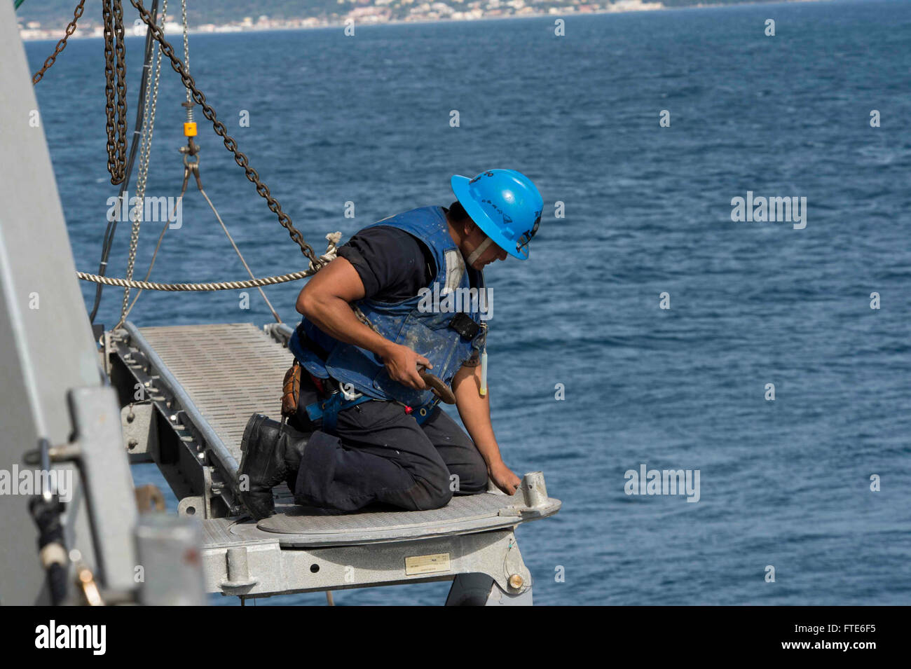 160322-N-TC720-059 CORFU, Greece (March 22, 2016) - Boatswain's Mate 2nd Class Allen Gashwytewa, from Waimanalo, Hawaii, stows the accommodation ladder aboard USS Donald Cook (DDG 75) March 22, 2016. Donald Cook, an Arleigh Burke-class guided-missile destroyer, forward deployed to Rota, Spain is conducting a routine patrol in the U.S. 6th Fleet area of operations in support of U.S. national security interests in Europe. (U.S. Navy photo by Mass Communication Specialist 2nd Class Mat Murch/Released) Stock Photo