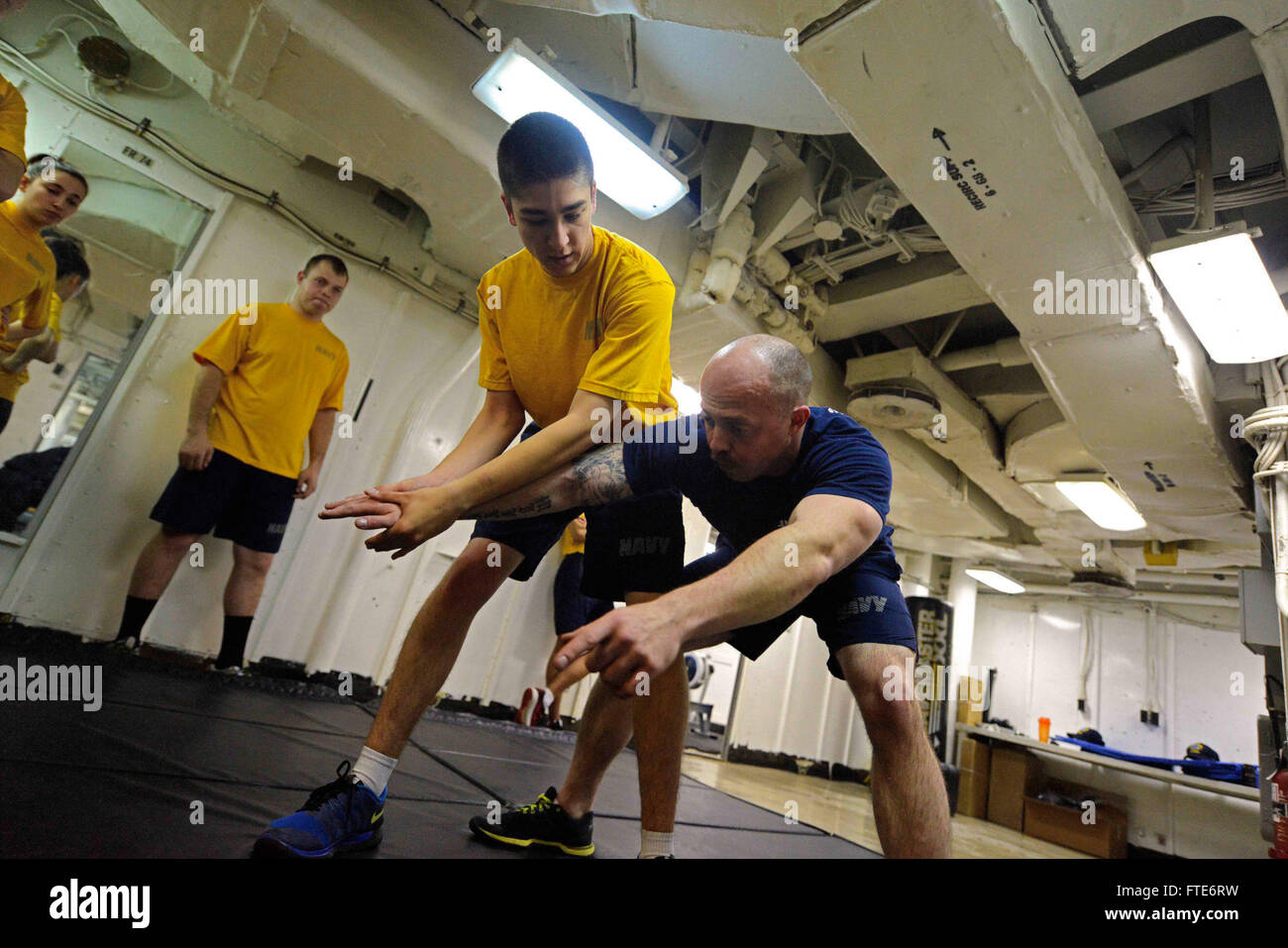 160302-N-VY489-010 MEDITERRANEAN SEA (March 2, 2016) Master-at-Arms 1st Class Mark Miller, right, demonstrates security force compliance techniques during Sentry/Security Reaction Force-Basic training aboard USS Mount Whitney (LCC 20) March 2, 2016. The course is a two-week security-training program that provides the fundamentals of watchstanding and the use of weapons to Sailors. Mount Whitney, the U.S. 6th Fleet command and control ship, forward deployed to Gaeta, Italy, is conducting naval operations in the U.S. 6th Fleet area of operations in support of U.S. National security interests in  Stock Photo