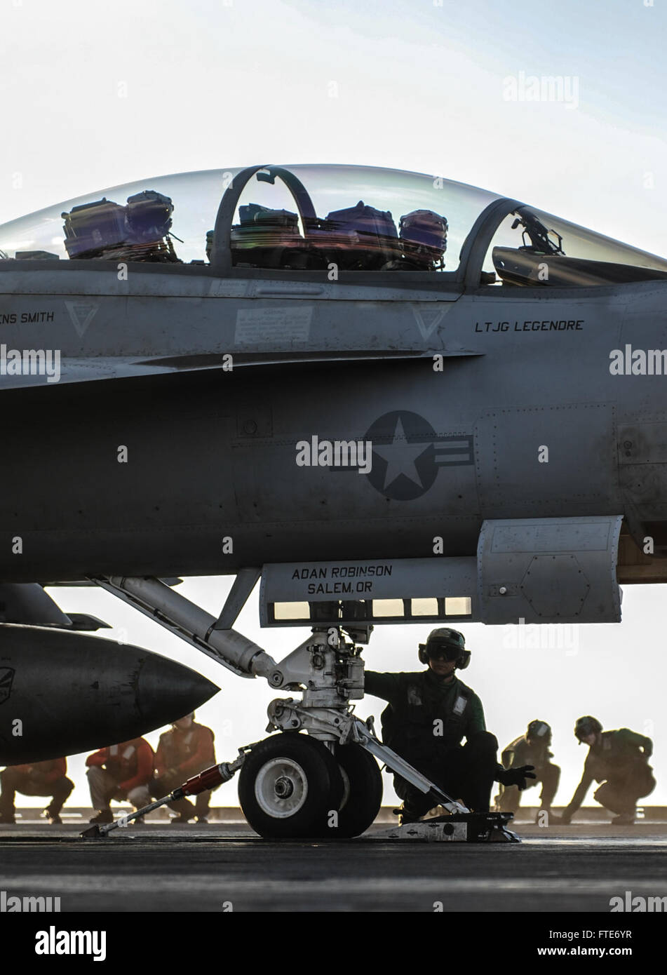Sailors on the USS Nimitz prepare an F/A-18F Super Hornet for takeoff in support of maritime security and regional cooperation operations in the U.S. 6th Fleet area of operations. Stock Photo