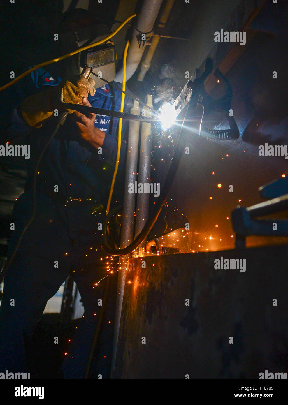 Hull Maintenance Technician 1st Class Matthew Stephens performs welding ...
