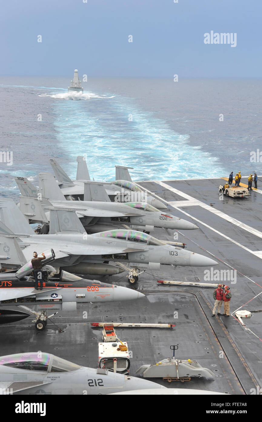 131105-N-UV347-098: MEDITERRANEAN SEA (Nov. 5, 2013) - The British Royal Navy destroyer HMS Dragon (D35) sails behind the aircraft carrier USS Nimitz (CVN 68). Nimitz is deployed supporting maritime security operations and theater security cooperation efforts in the U.S. 6th Fleet area of operations. (U.S. Navy photo by Mass Communication Specialist Seaman Eric M. Butler/ Released) Stock Photo